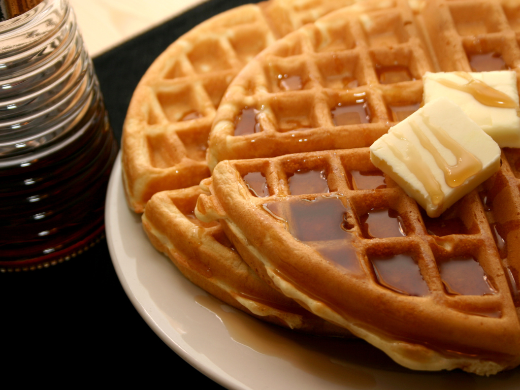 Golden waffles topped with melted butter and syrup from a breakfast cooking class at Farmhouse Academy near Lockport, Frankfort, and Mokena, Illinois