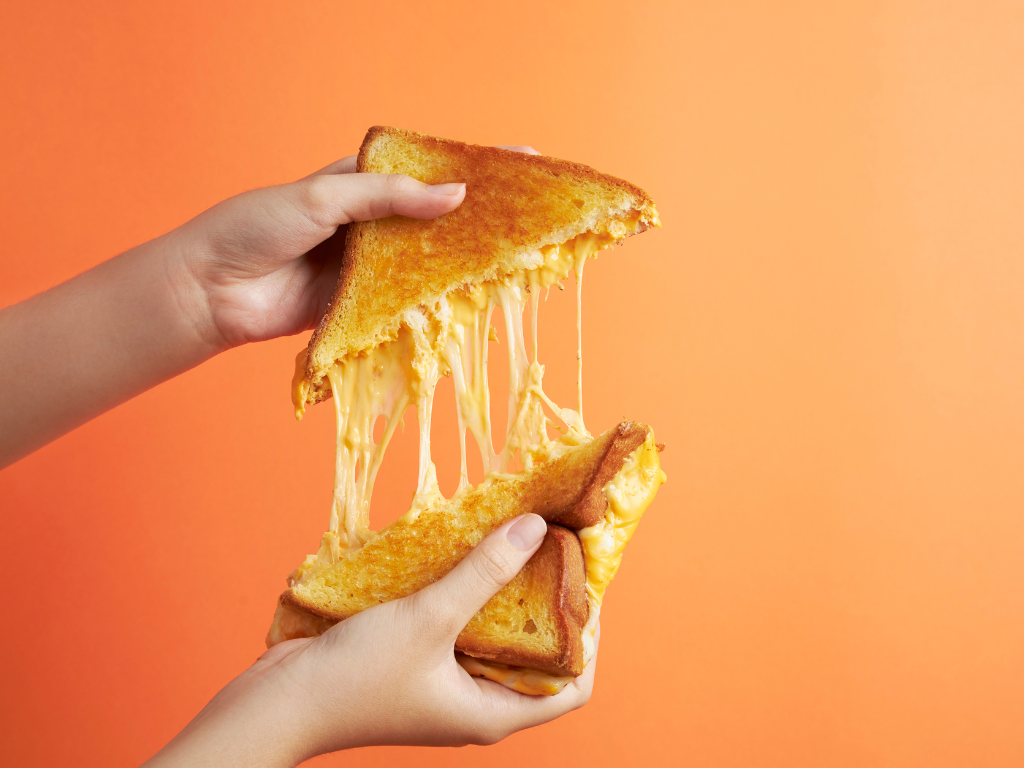Satisfy your cheesy cravings! Join our hands-on cooking classes in Mokena, Chicago, and Crest Hill, where kids and families learn to master the art of the ultimate grilled cheese pull.