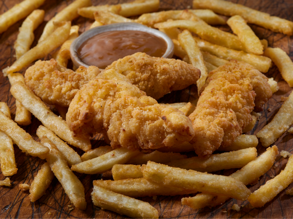 Crispy golden chicken tenders with fries and dipping sauce, featured in our kid-friendly cooking classes in Mokena, Crest Hill, and greater Chicago. Learn to make classic comfort food the fun and easy way!