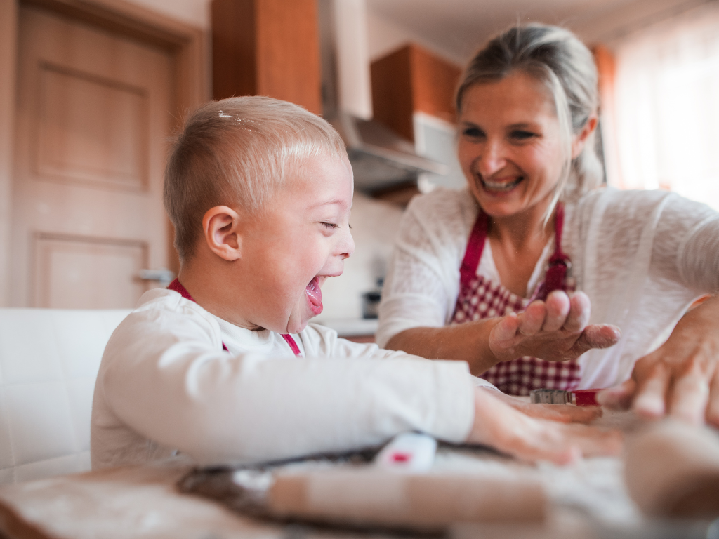 Happy family baking together during a kids cooking class at Farmhouse Academy near New Lenox, Tinley Park, and Orland Park, Illinois