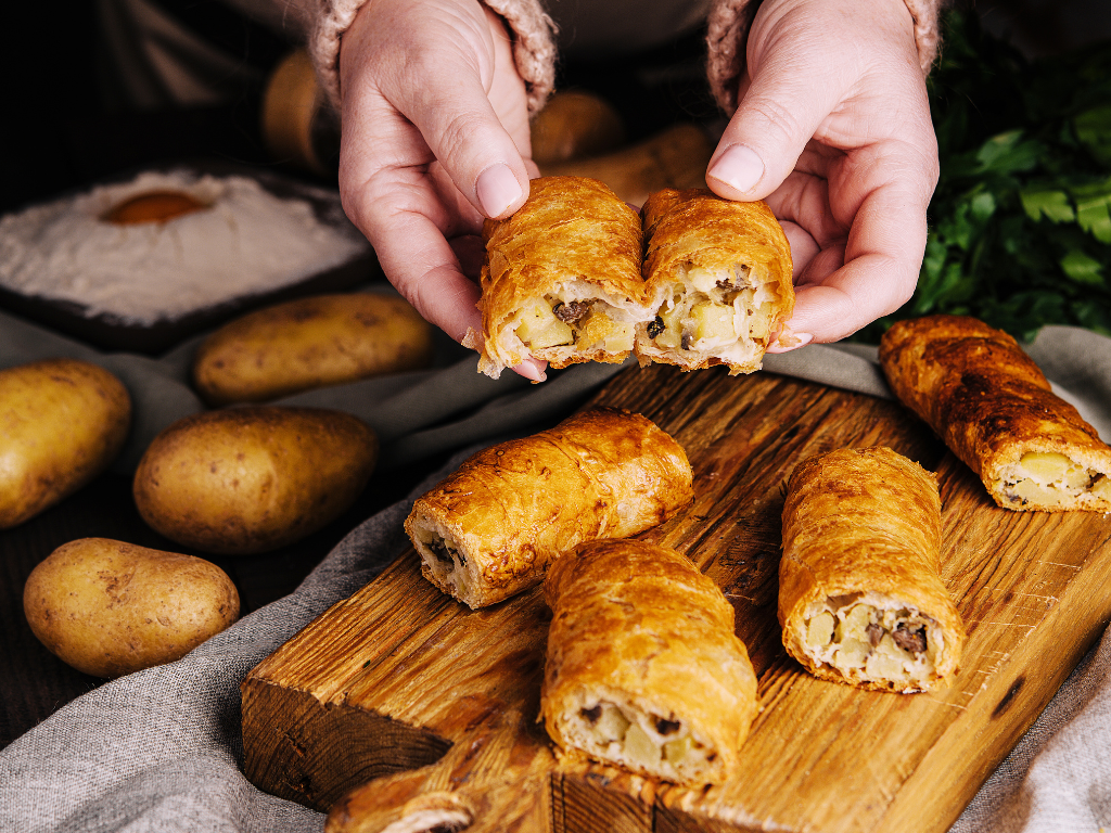 Golden, flaky potato and meat pastry rolls are freshly baked and ready to serve—perfect for showcasing hands-on cooking class experiences in Mokena, Crest Hill, and Chicago’s surrounding communities