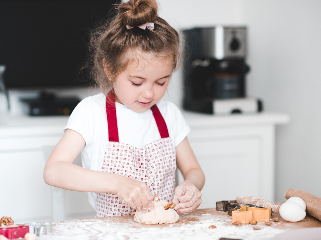 Young chef-in-training having fun with cookie dough in a hands-on kids’ baking class in Mokena, Crest Hill, or Chicago. Learn, laugh, and bake sweet memories together