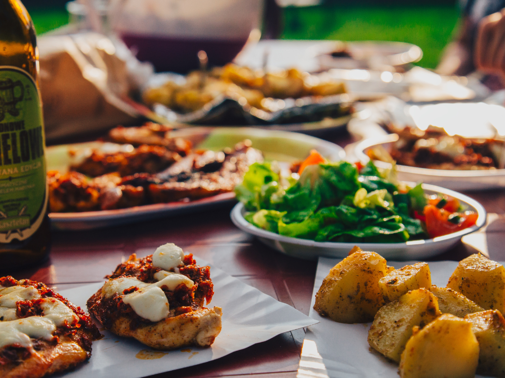 Enjoy the flavors of outdoor dining with fresh greens, roasted potatoes, and cheesy chicken—perfect inspiration from Chicago, Crest Hill, and Mokena cooking classes focused on rustic, hearty meals