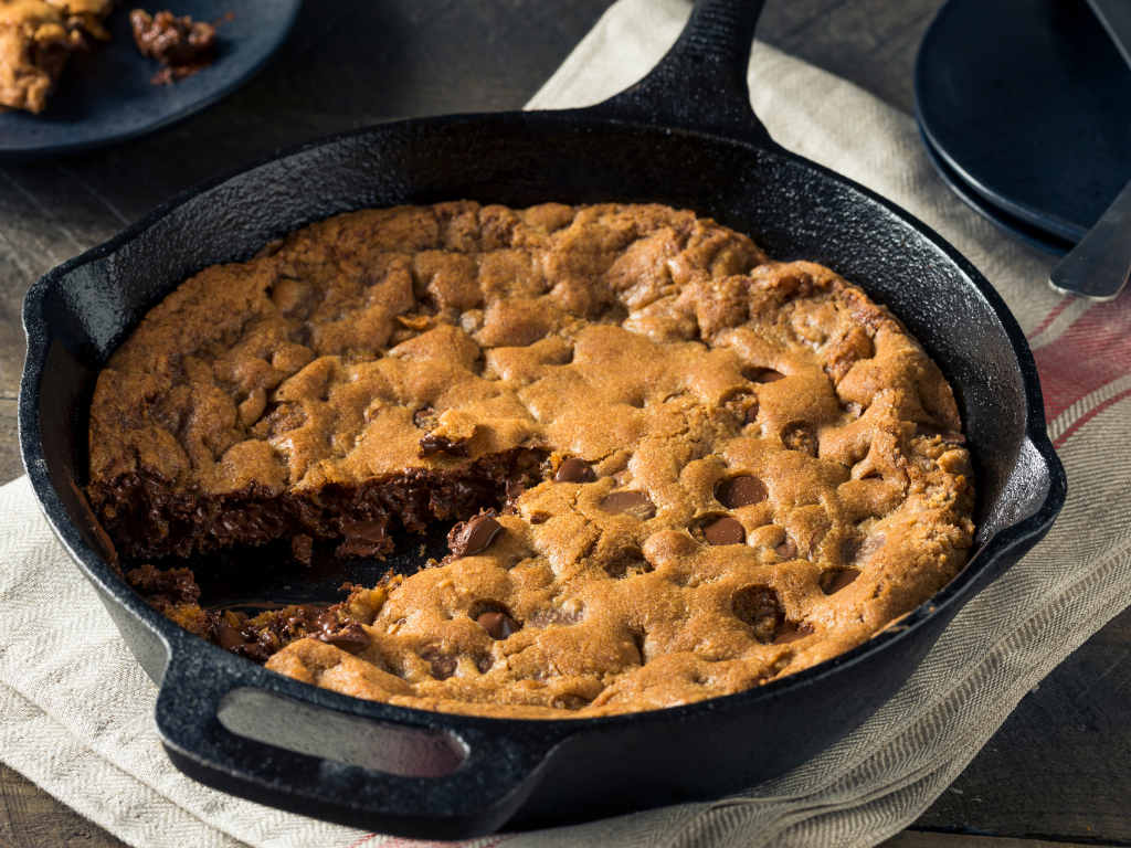 Warm, gooey chocolate chip skillet cookie made fresh in our hands-on cooking classes for kids and families in Mokena, Crest Hill, and Chicago. Learn the art of sweet treats in a fun, delicious way