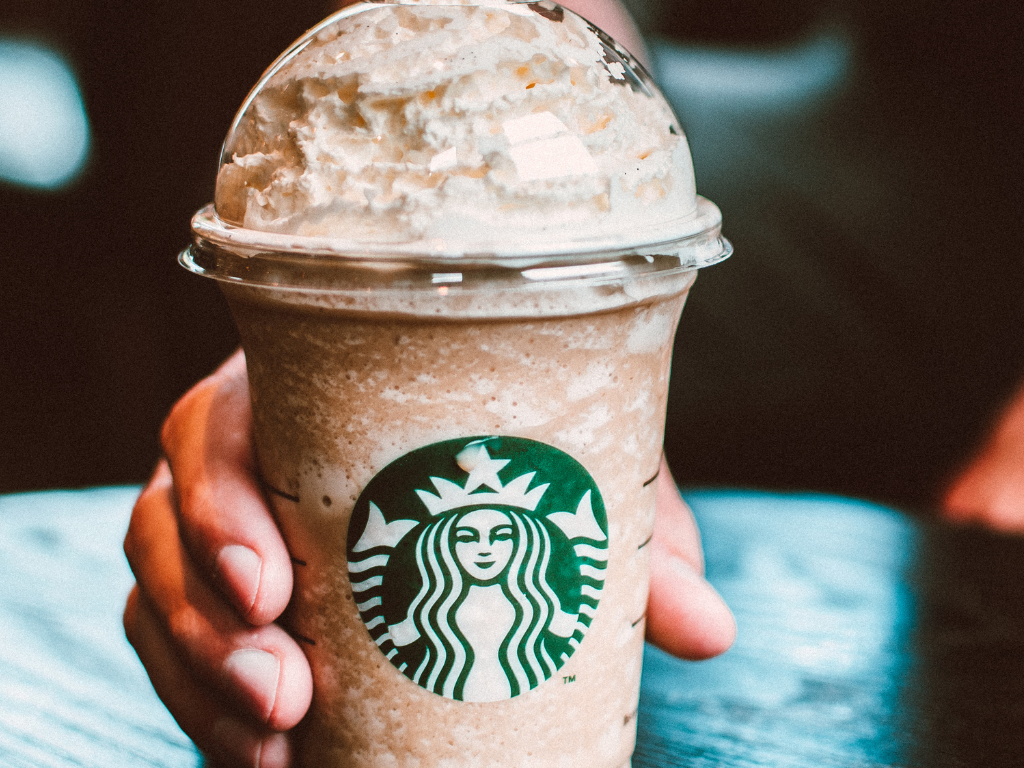Close-up of a creamy Starbucks Frappuccino served with whipped topping—perfect refreshment for coffee lovers around Mokena, Crest Hill, and the greater Chicago area